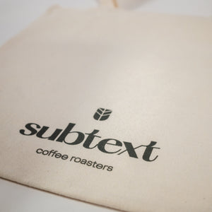 
                  
                    Load image into Gallery viewer, Printed Cotton Tote: &amp;quot;Drink Subtext Coffee&amp;quot;
                  
                