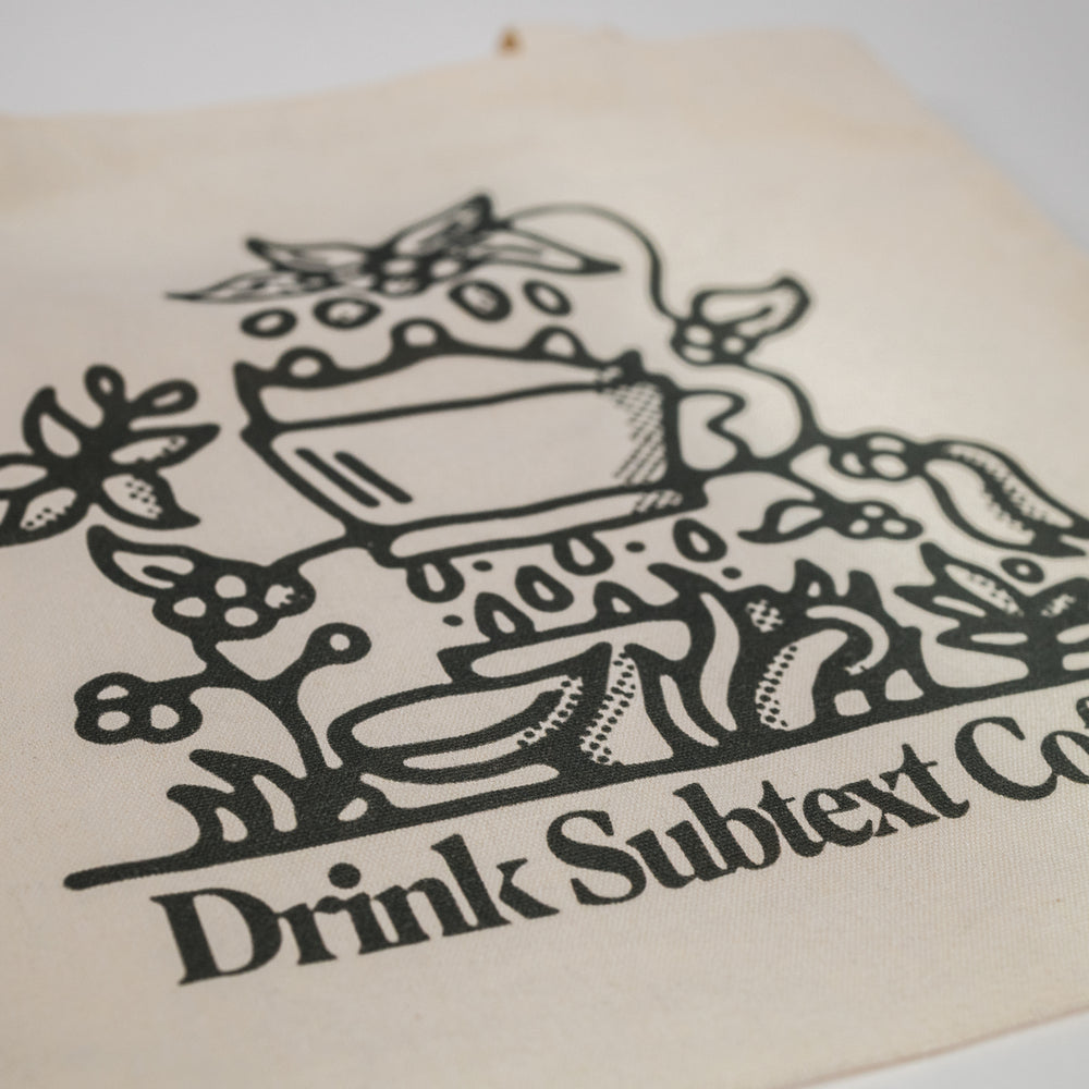 
                  
                    Load image into Gallery viewer, Printed Cotton Tote: &amp;quot;Drink Subtext Coffee&amp;quot;
                  
                